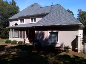 A house in Charlotte, NC with roofing shingles installed